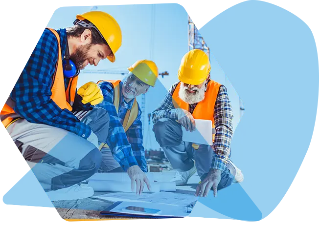 group of men in hard hats looking at plans