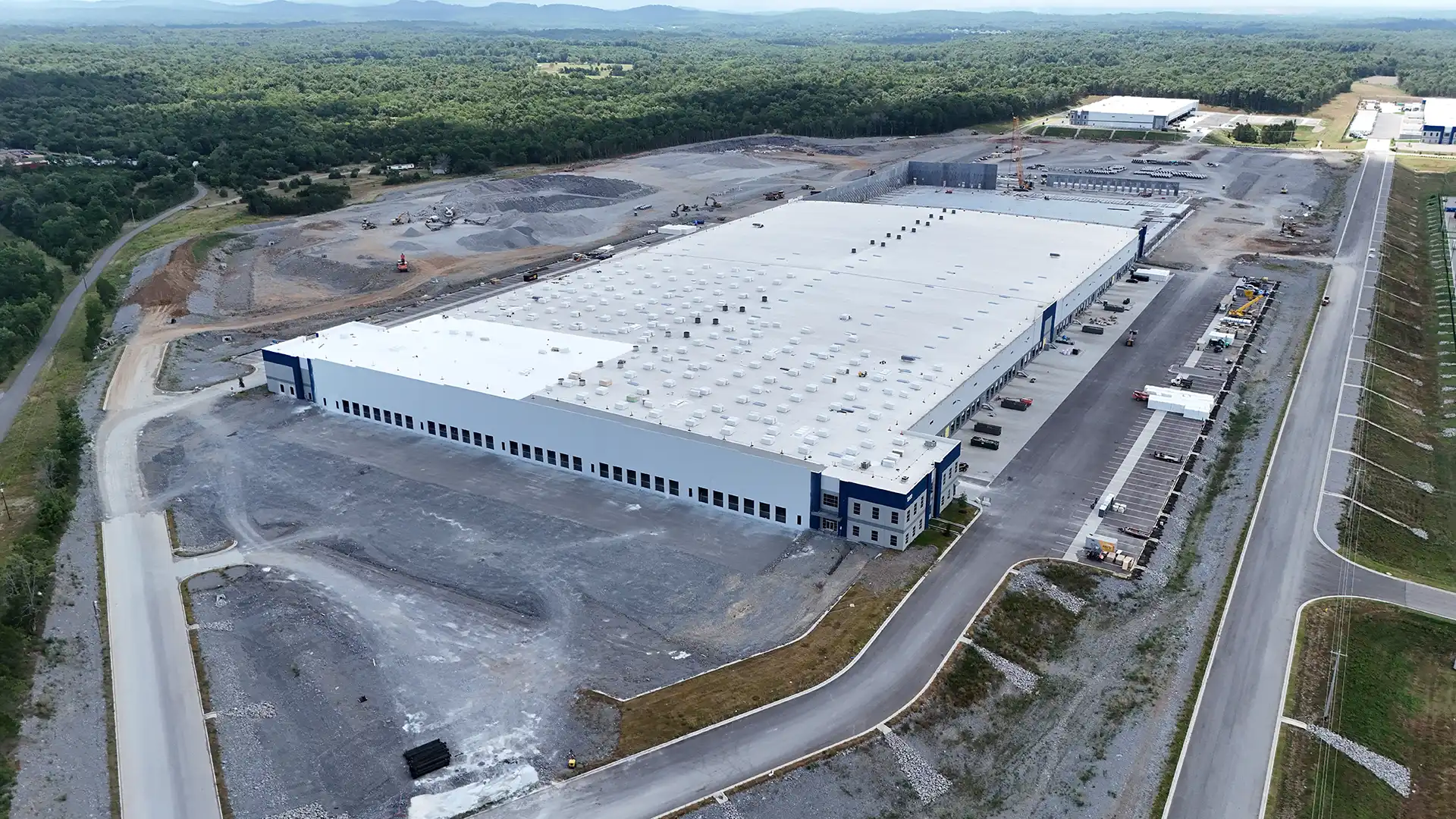 lawler president, controlloer, and scheduler standing in front of lawler construction