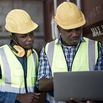 Prime contractor and project manager reviewing certified payroll reports